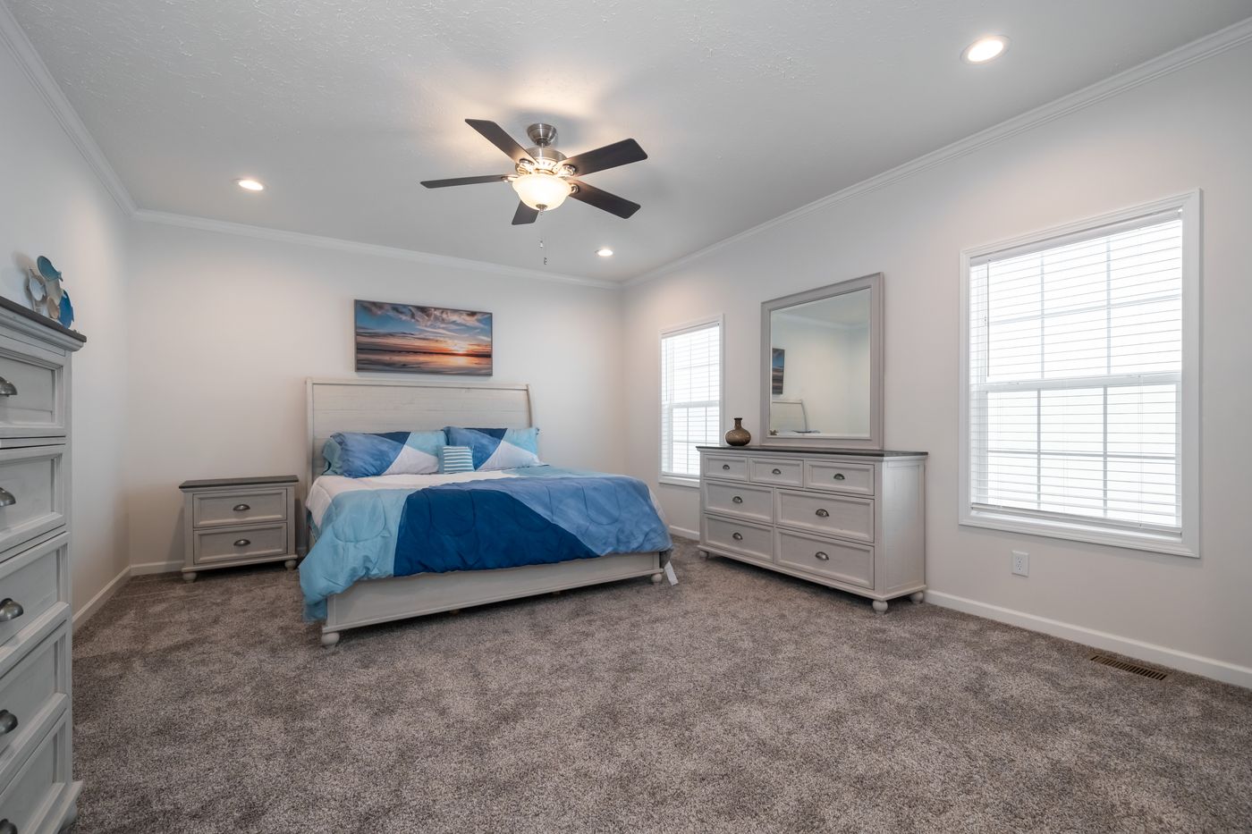 The 3458 HUD 76X32 CAROLINA RAELYN Primary Bedroom. This Manufactured Mobile Home features 4 bedrooms and 3 baths.