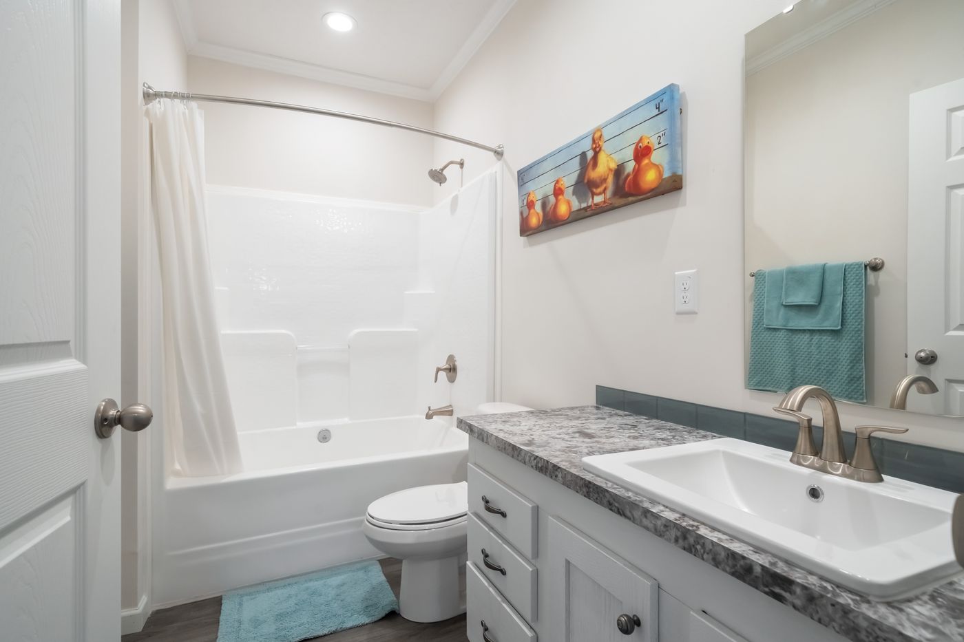 The 3458 HUD 76X32 CAROLINA RAELYN Guest Bathroom. This Manufactured Mobile Home features 4 bedrooms and 3 baths.