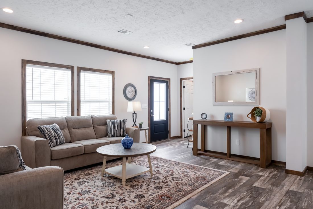 The 3237 THE TYBEE HUD Living Room. This Manufactured Mobile Home features 4 bedrooms and 3 baths.